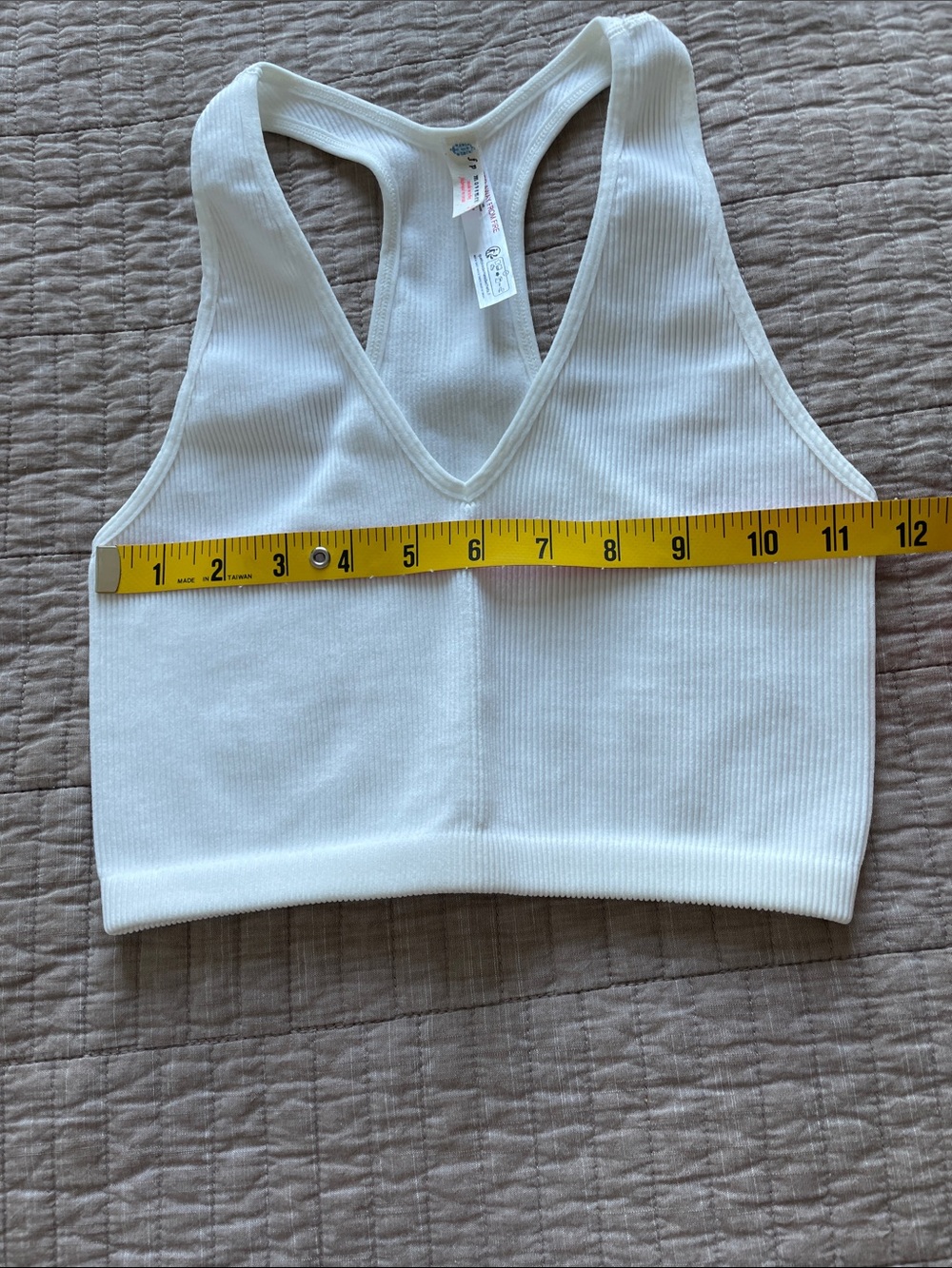 FP Movement by Free People White Ribbed Racerback Tank stretching - Picture 4 of 5